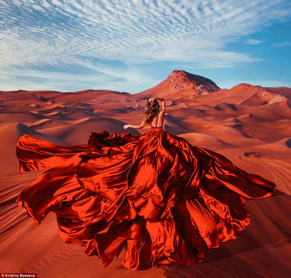 4eb0cb2400000578-0-image-a-39_1532959853479 This model's stunning red gown blows in the breeze and blends in with the red sand of the Rub Al Khali Desert in Oman