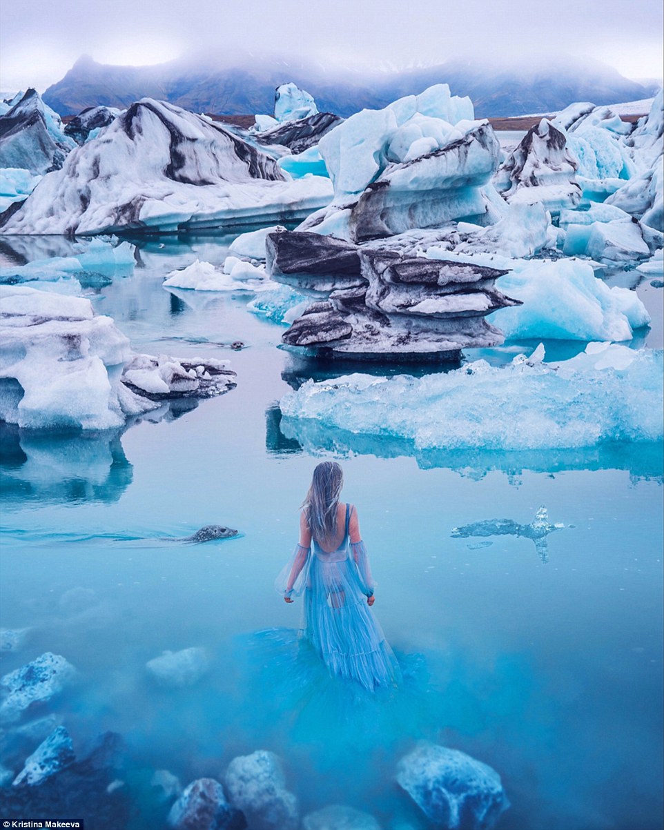 4eb0cbb700000578-6007237-image-a-7_1533020386071 In this spectacular shot, a model braves the waters of the Glacier Lagoon in Iceland wearing a dress that matches the colour of the water