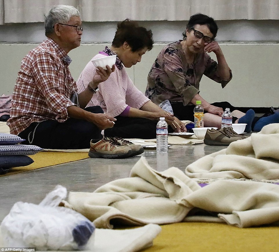 4fe0a81e00000578-6145357-above_weary_looking_residents_who_had_to_evacuate_from_their_hom-m-49_1536406511374 Above, weary-looking residents who had to evacuate from their homes are seen here eating their dinner while at a shelter in Atsuma town, Hokkaido prefecture