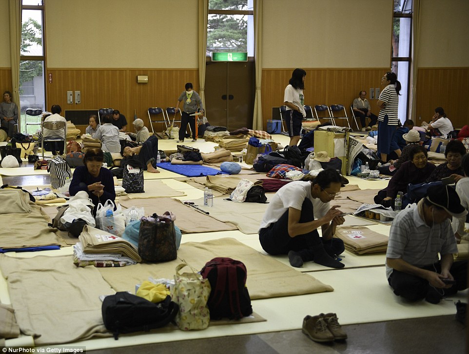4fe1092800000578-6145357-image-m-63_1536409735216 Residents sleep on the floor of an emergency evacuation centre on the third day after a massive landslide destroyed homes and killed 35 people in Atsuma