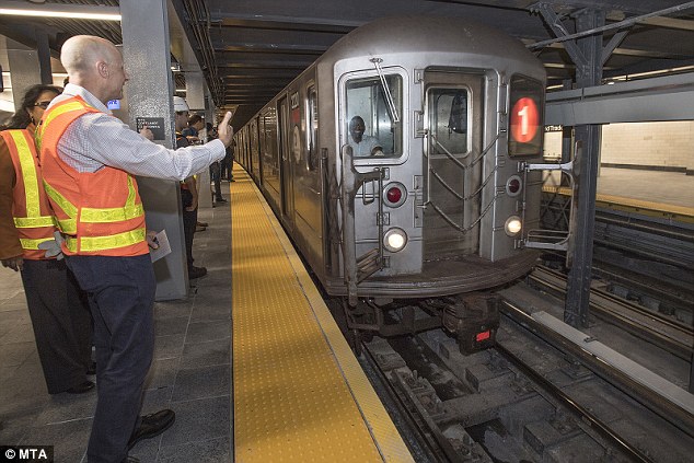 4fe8049f00000578-0-image-a-3_1536444166361 Officials look on as the first train pulls into the new WTC Cortlandt station on Saturday