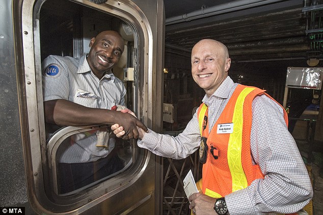 4fe804c500000578-0-image-a-4_1536444182171 New York City Transit Authority Andy Byford (right) greets the train operator after the first train in 17 years stops at the newly reconstructed station on Saturday