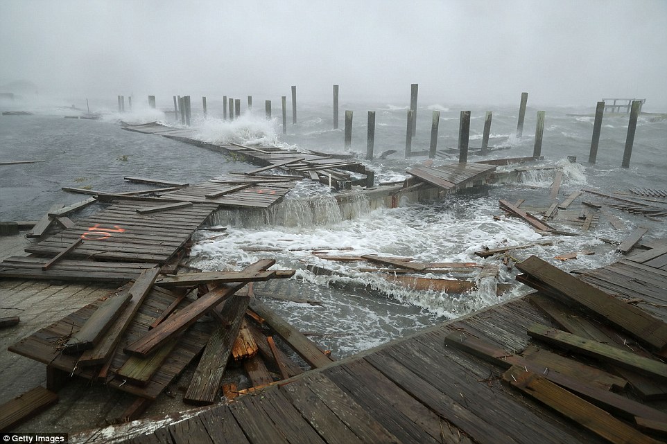 Portions of a boat dock and boardwalk were destroyed by powerful wind and waves in Atlantic Beach, North Carolina, on Thursday 