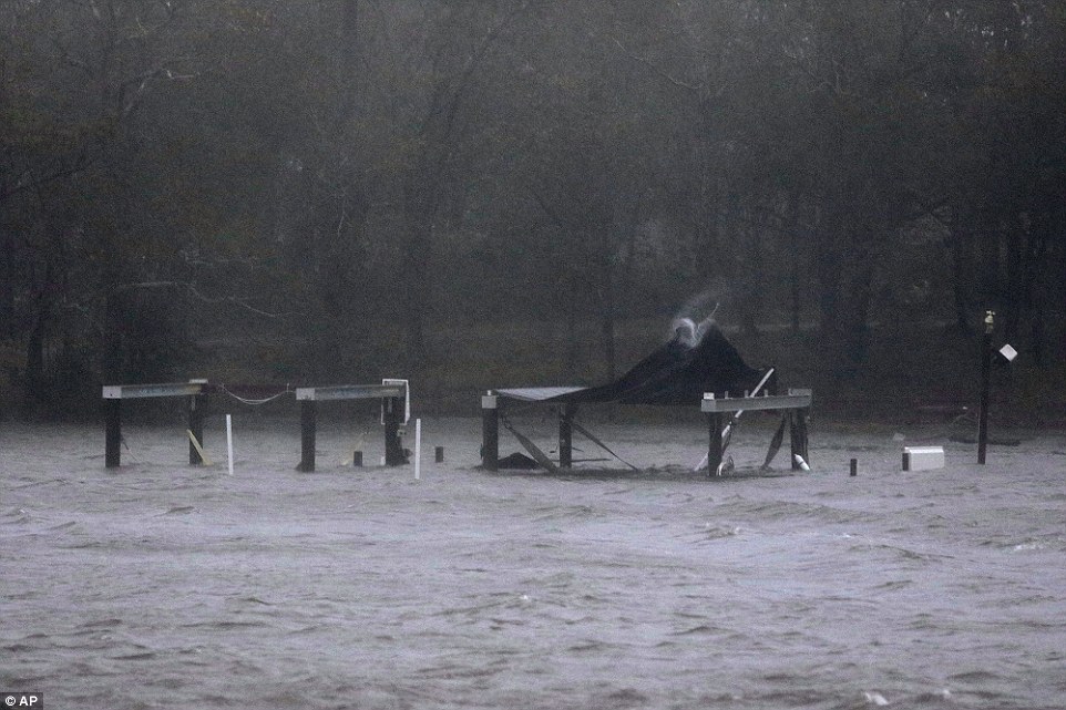 People were urged to avoid going out in their vehicles in Swansboro in North Carolina (pictured on Friday) over fears they could be swept away 