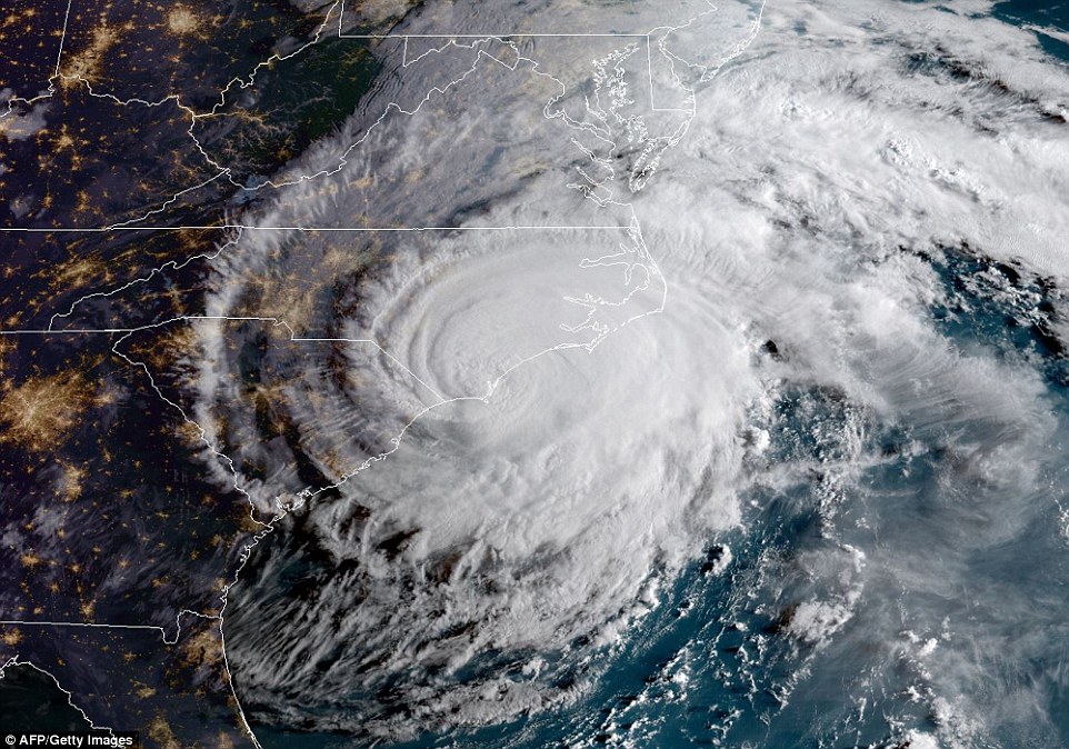 This satellite map shows Florence making landfall on the East Coast on Friday with 90mph winds causing havoc for people who decided to stay put
