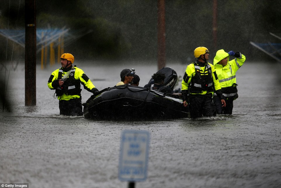 502cf17600000578-0-image-a-40_1536976460470 Rescuers bring residents to safety after they remained in the mandatory evacuation zone during Hurricane Florence