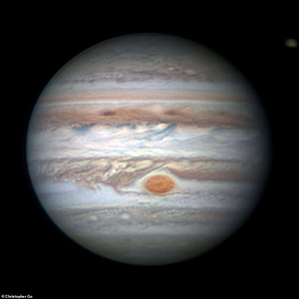 7387238-6492387-this_earth_based_observation_of_jupiter_and_the_south_tropical_d-a-26_1544717567015 This Earth-based observation of Jupiter and the South Tropical Disturbance approaching the Great Red Spot was captured on January 26, 2018. The Juno probe reached Jupiter on July 4, 2016, after a five-year, 1.8 billion-mile (2.8bn km) journey