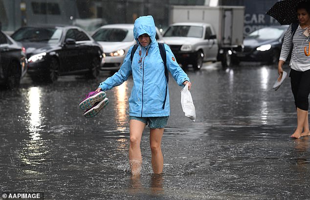 7401544-6494811-melbourne_s_inner_city_flooded_with_pedestrians_forced_to_wade_t-a-11_1544828872932 Melbourne's inner-city flooded, with pedestrians forced to wade through the high waters