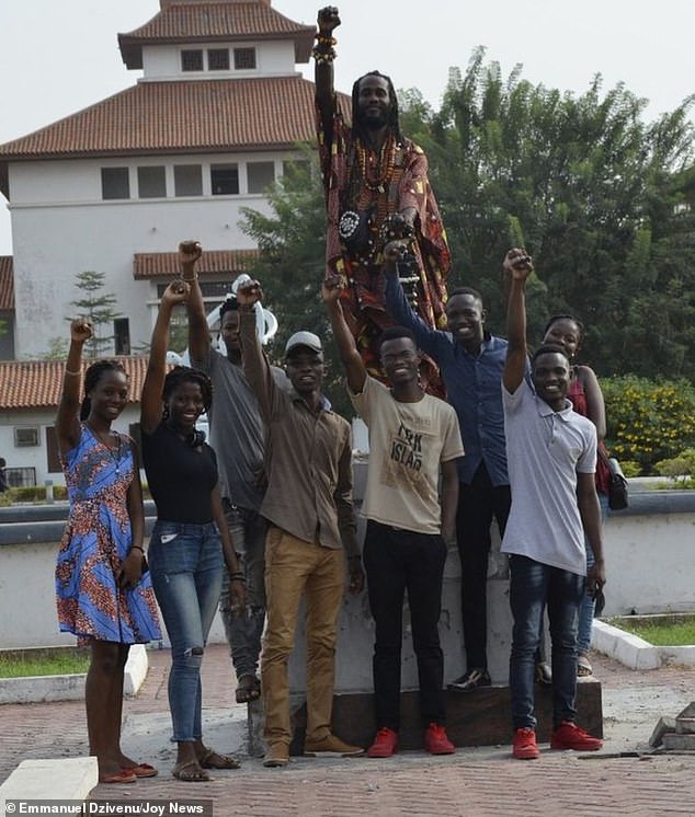 7432592-6496609-image-m-58_1544802795025 Lecturers and students stand triumphant in front of the empty plinth after they pulled down the statue of Gandhi from the university's recreational quadrangle