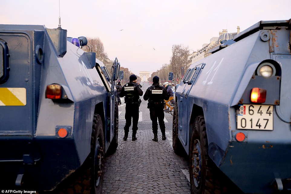 7456700-6498733-image-a-10_1544866604508 Around 8,000 police officers have been deployed in Paris ahead of a fifth consecutive week of demonstrations today