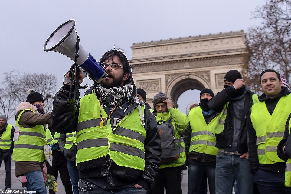 7456714-6498733-image-a-3_1544866584370 Yellow vest protesters take to the streets of Paris this morning for a fifth consecutive week of protests against the government