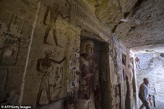 7474114-6498949-image-a-232_1544915255539 The tomb contains more than a dozen niches and 24 colourful statues of the cleric and members of his family