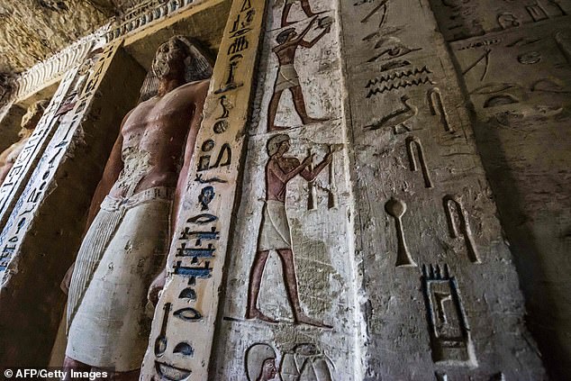7474136-6498949-image-a-231_1544915245708 The rightly painted tomb is decorated with scenes showing the royal priest alongside his mother, wife and other members of his family