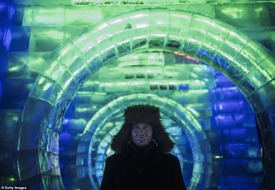 7894986-6535251-image-a-56_1545996824862 The man behind the curtain: A team of workers spent 15 days creating the 'frozen city' theme park for this year's festival