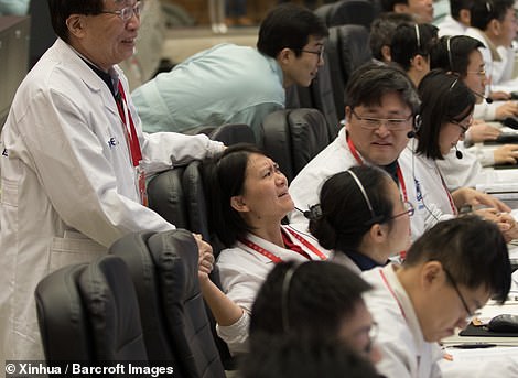 8077348-6551733-emotional_space_technicians_celebrate_the_landing_at_the_beijing-a-53_1546550070370 Emotional space technicians celebrate the landing at the Beijing Aerospace Control Centre on January 3. Beijing is pouring billions into the military-run programme, with hopes of having a crewed space station by 2022, and of eventually sending humans to the moon