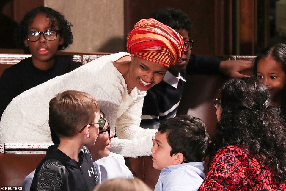 8099294-6555271-image-a-126_1546544325360 Mingling time: New congresswoman Ilhan Omar, 37, chatted with other members of Congress and their children