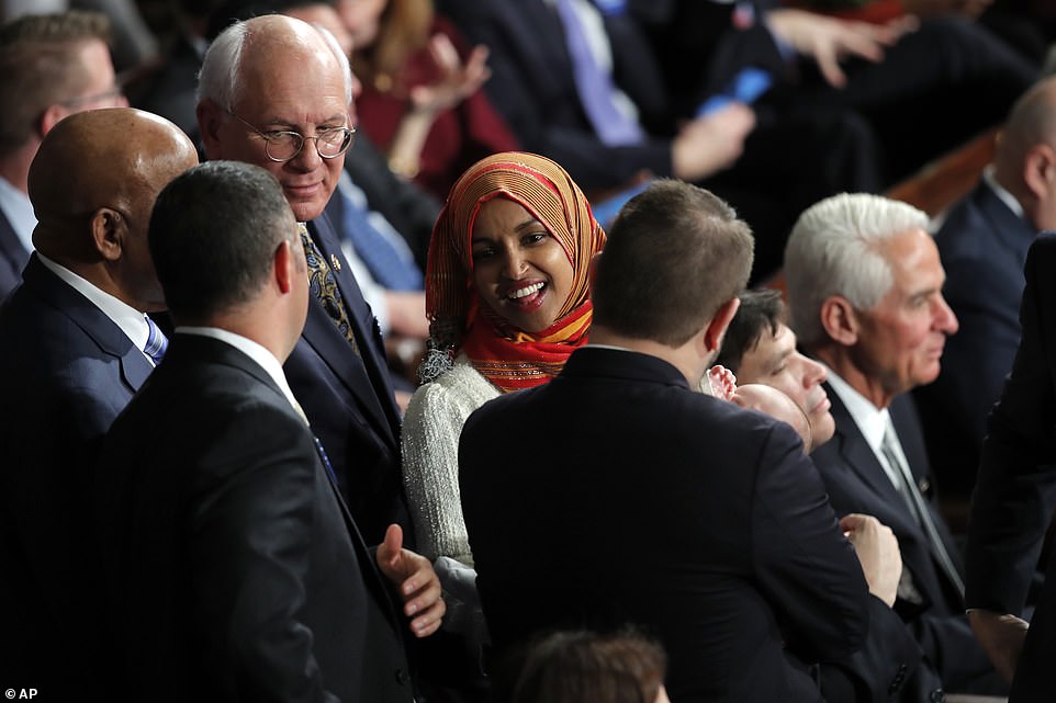 8100482-6555271-image-a-139_1546544479939 Greeting: Ilhan Omar speaks to other members of Congress as they wait for the arrival of Nancy Pelosi