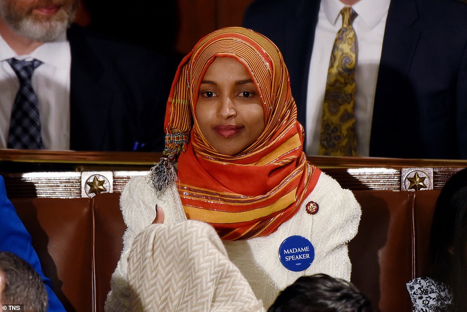 8100496-0-image-a-142_1546544580450 Moment of history: Ilhan Omar took her seat wearing the hijab, the first ever woman to do so and the first person to wear a religious head covering in Congress