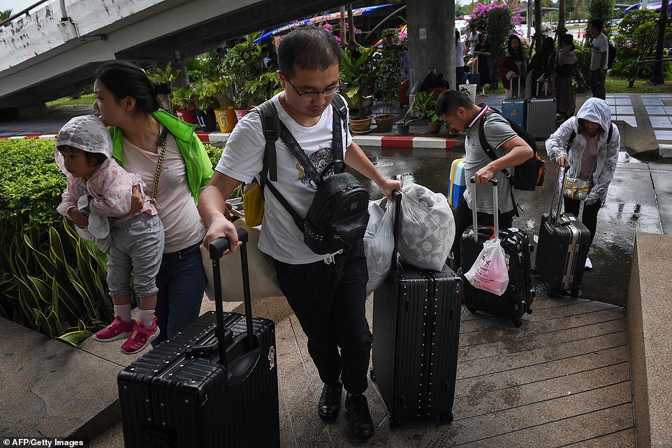 8118100-6556803-chinese_tourists_disembark_at_surat_thani_airport_after_tour_ope-a-41_1546593450852 Chinese tourists disembark at Surat Thani airport after tour operators were forced to suspend boats to tourist islands due to tropical storm Pabuk