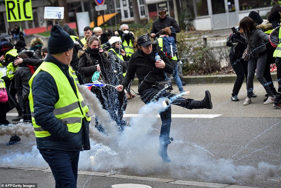 8159506-6560213-a_yellow_vest_anti_government_protester_kicks_a_teargas_shell_du-a-64_1546698107147 A yellow vest anti-government protester kicks a teargas shell during a rally in Nantes today. Teargas and batons were used by riot police on a so-called ‘Act VIII’ Day of Rage organised by the Yellow Vest movement