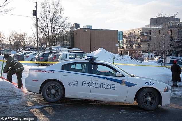 9584002-6684315-image-a-15_1549692596707 Police perimeter at the parking lot of the Islamic Cultural Center in Quebec City, Canada on January 30, 2017