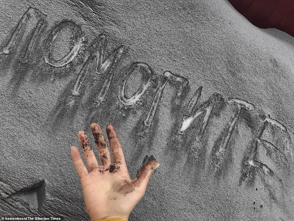 9862072-6709027-a_local_resident_even_wrote_the_russian_word_or_help_us_in_the_f-a-32_1550242803399 A local resident even wrote the Russian word 'ÐÐÐÐÐÐТÐ' - or 'help us' - in the filthy snow to show how dirty the city of Kiselevsk had becomeÂ
