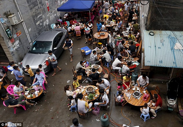 Party atmosphere: Revellers fill the streets and restaurants at the festival, a celebration of the summer solstice