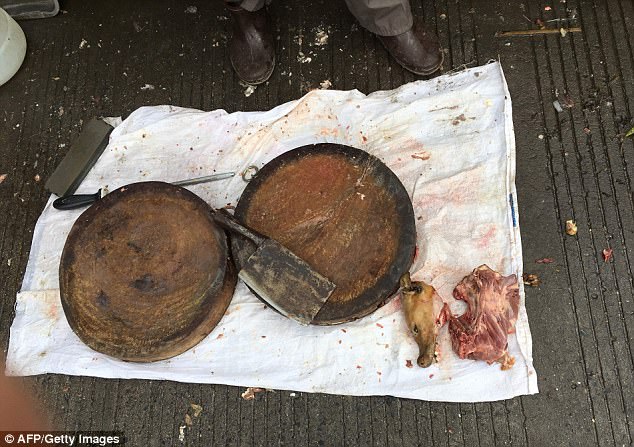 A vendor uses the boards to chop dog meat at the Nanqiao market in Yulin on June 21