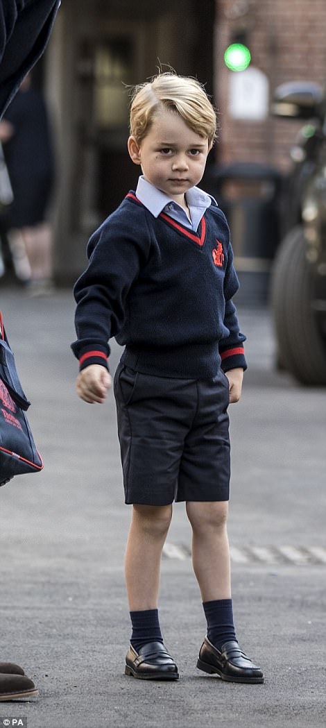 George rubbed his nose and looked down before looking towards the small group of invited media at the school door