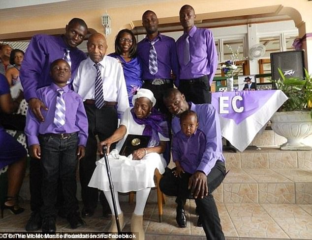 The supercentenarian is pictured here with her great-grandchildren in Jamaica 