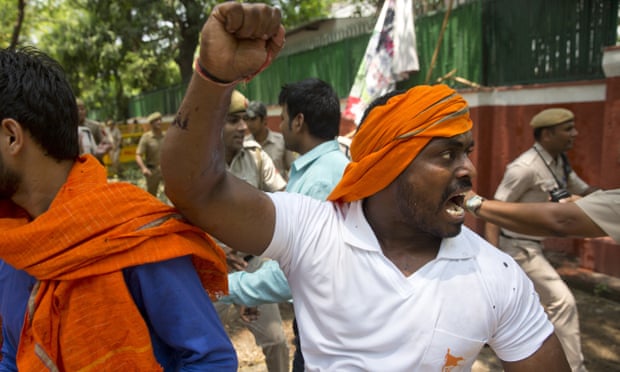 Activists from India’s ruling party protest against the slaughter of a calf by members of the Congress party’s youth wing in New Delhi.