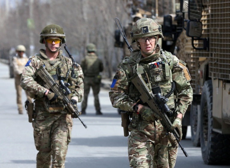 British soldiers with NATO-led Resolute Support Mission arrive at the site of an attack in Kabul, Afghanistan