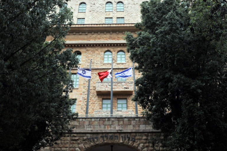 The national flags of Israel and Bahrain flutter at the entrance of the King David Hotel in Jerusalem