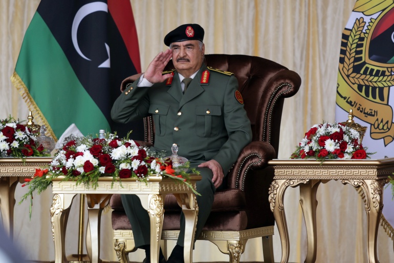 rtx8i5j3-2 Libyan military commander Khalifa Haftar gestures during Independence Day celebrations in Benghazi