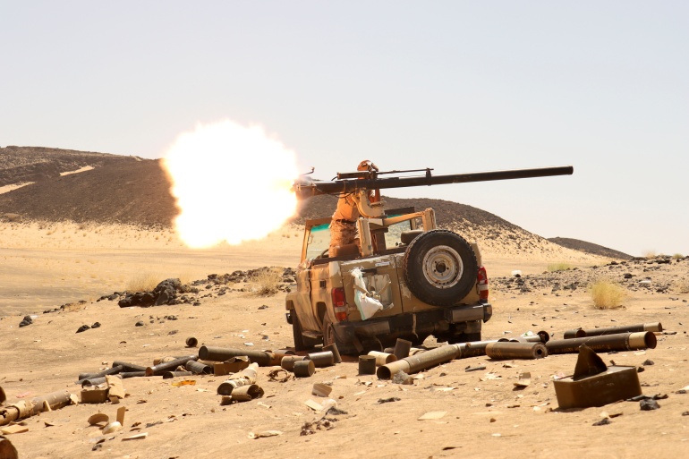 rtxbn3yv-2 Yemeni government fighter fires a vehicle-mounted weapon at a frontline position during fighting against Houthi fighters in Marib