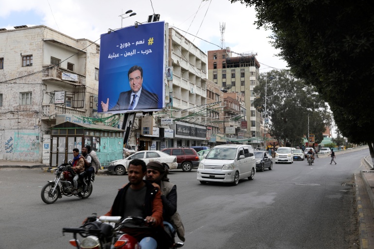 Poster of Lebanese Information Minister George Kordahi is seen on a billboard in Sanaa, Yemen