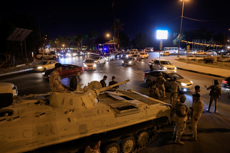 rtxjo3uf-2 Iraqi soldiers take part in an intensive security deployment following a drone attack on Prime Minister Mustafa al-Kadhimi's residence in Baghdad