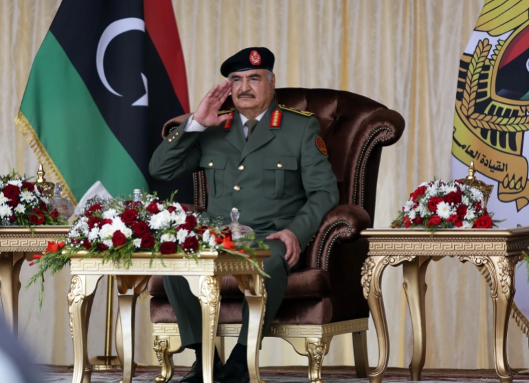 rtx8i5j3 Libyan military commander Khalifa Haftar gestures during Independence Day celebrations in Benghazi
