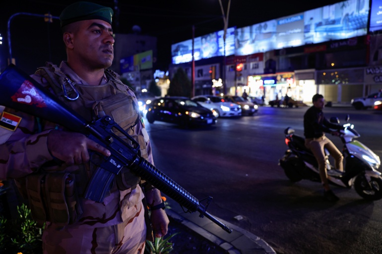 An Iraqi soldier takes part in an intensive security deployment following a drone attack on Prime Minister Mustafa al-Kadhimi's residence in Baghdad