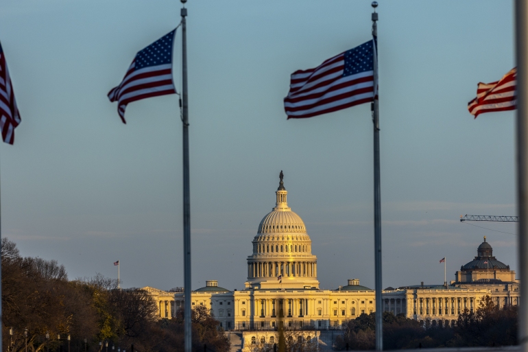 26290059-1 Views of Washington DC Views of Washington DC- - WASHINGTON DC, USA - DECEMBER 2: The U.S. Capitol is seen behind American National flags in Washington DC on December 02, 2021. DATE 03/12/2021 SIZE x SOURCE Anadolu/Kerem Yucel