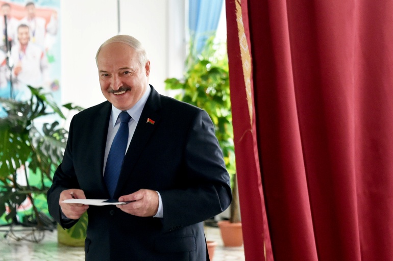 rtx7ogpg Belarusian President Alexander Lukashenko visits a polling station during the presidential election in Minsk