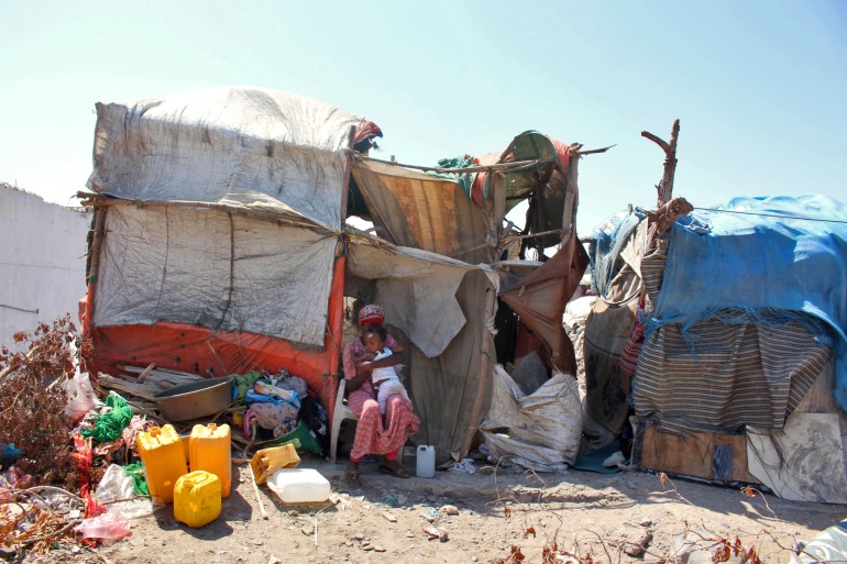 000_324d9ne-1 Ethiopian refugees are pictured at a camp for migrants of African origin in the Khor Maksar district of Yemen's second city of Aden on March 3, 2022. (Photo by Saleh OBAIDI / AFP)