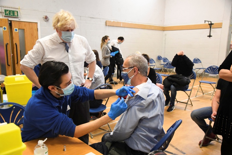 British Prime Minister Boris Johnson visits a vaccination centre in Westminster