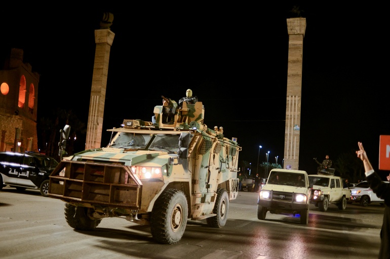 rts5ez2l-2-1 Members of the military personnel arrive to take part in a parade calling for parliamentary and presidential election, in Tripoli
