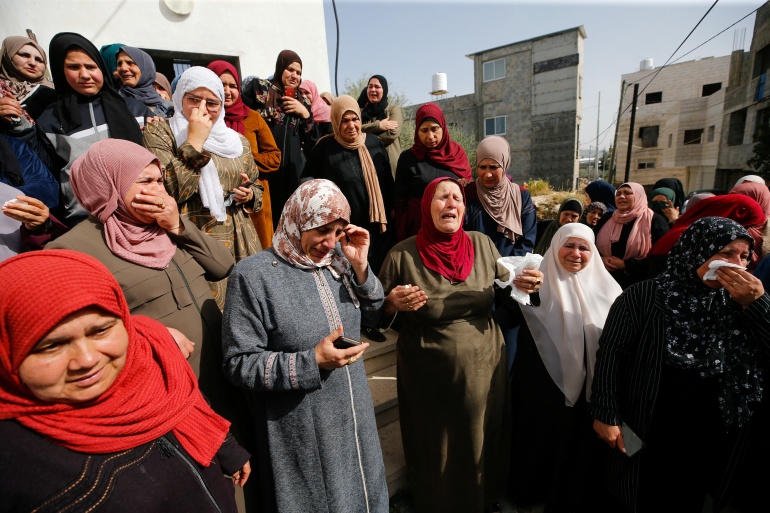rts6y8gk People react during a funeral of Palestinian woman, in Husan