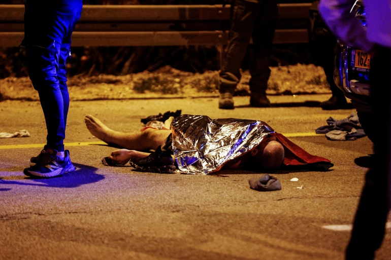 rts6ygen-1 A dead body is seen on the ground following an incident in a junction at the entrance to Ashkelon