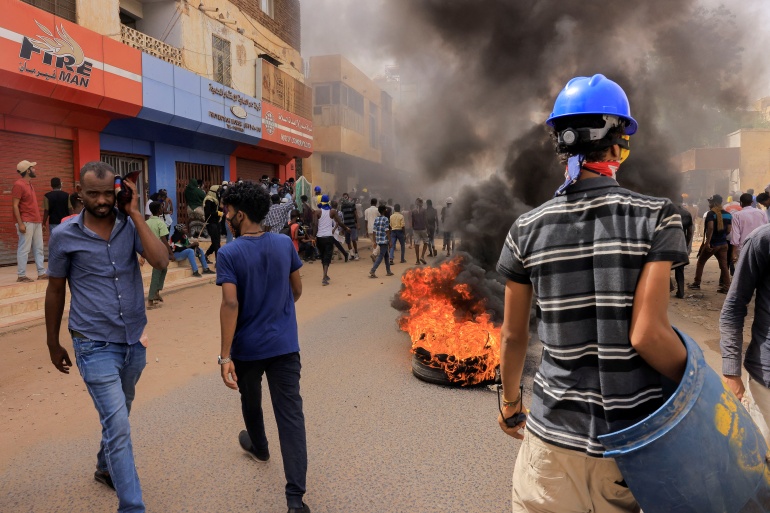 rts7s7xx-1 Protesters march during rally against military rule in Khartoum