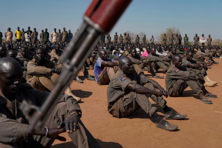 rts32cfh-1 South Sudan soldiers gather at the training site for the joint force to protect VIPs in Gorom outside Juba