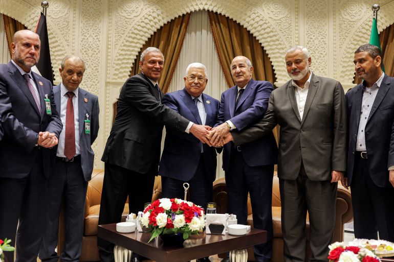 000_32dv7pq-1 A handout picture provided by the Palestinian Authority's press office (PPO) on July 5, 2022 shows (L to R) Palestinian president Mahmud Abbas (C) meeting with Algerian President Abdelmajid Tebboune (C-R) and with Palestinian Hamas movement's leader Ismail Haniyeh (2nd-R) during Abbas' visit to attend Algeria's 60th independence anniversary in its capital Algiers. (Photo by Mohamed AL-HAMMADI / PPO / AFP) / === RESTRICTED TO EDITORIAL USE - MANDATORY CREDIT "AFP PHOTO / HO / PPO " - NO MARKETING NO ADVERTISING CAMPAIGNS - DISTRIBUTED AS A SERVICE TO CLIENTS ===