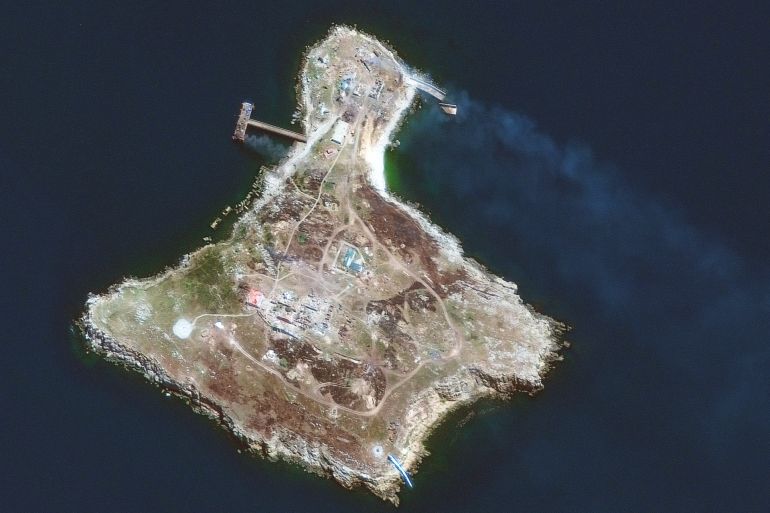 120-1 epa10043932 A handout satellite image made available by Maxar Technologies shows smoke can be seen from burning vehicles/structures at several locations across the northern section of Snake Island, Zmiinyi Island, or Snake Island, in the Black Sea, 30 June 2022. Russian forces withdrew from the Black Sea outpost Snake Island, the Russian Defence Ministry said in a statement on 30 June 2022. On 24 February 2022 Russian troops entered the Ukrainian territory in what the Russian president declared a 'Special Military Operation', starting an armed conflict that has provoked destruction and a humanitarian crisis. EPA-EFE/MAXAR TECHNOLOGIES HANDOUT -- MANDATORY CREDIT: SATELLITE IMAGE 2022 MAXAR TECHNOLOGIES -- THE WATERMARK MAY NOT BE REMOVED/CROPPED -- HANDOUT EDITORIAL USE ONLY/NO SALES